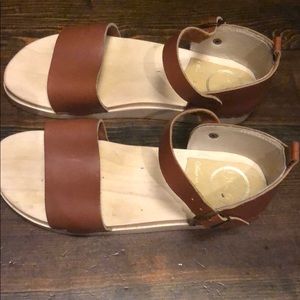 No. 6 “Wear in Good Health”brown leather sandals.